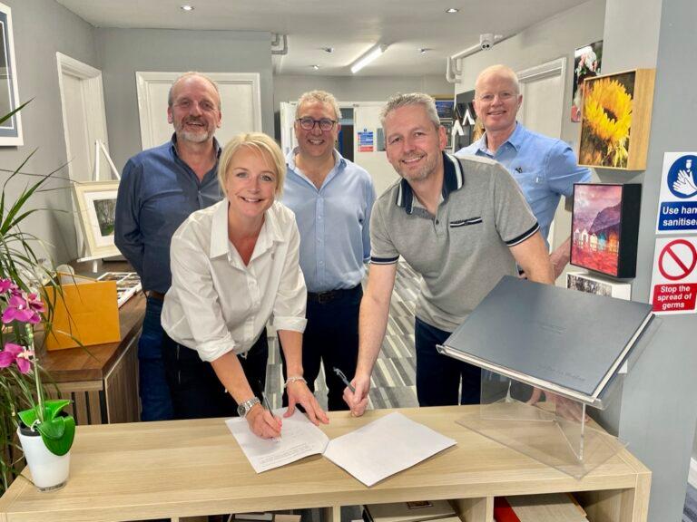 Jill Roe and Mike Brydon met on a flight home from Tilburg. Three years later they were ready to merge — without a clue how. A mentor who had done it before turned fear into a 35-person business.